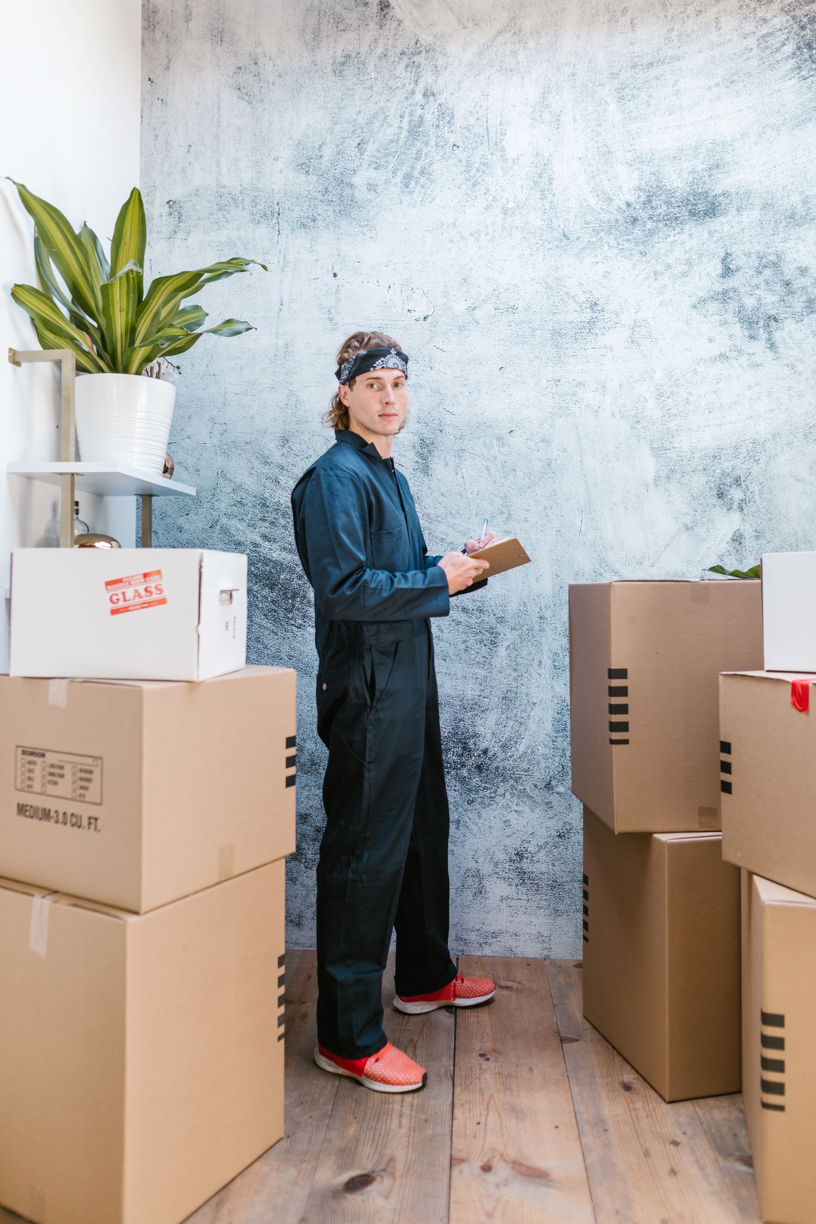 Mover checking packages in a warehouse