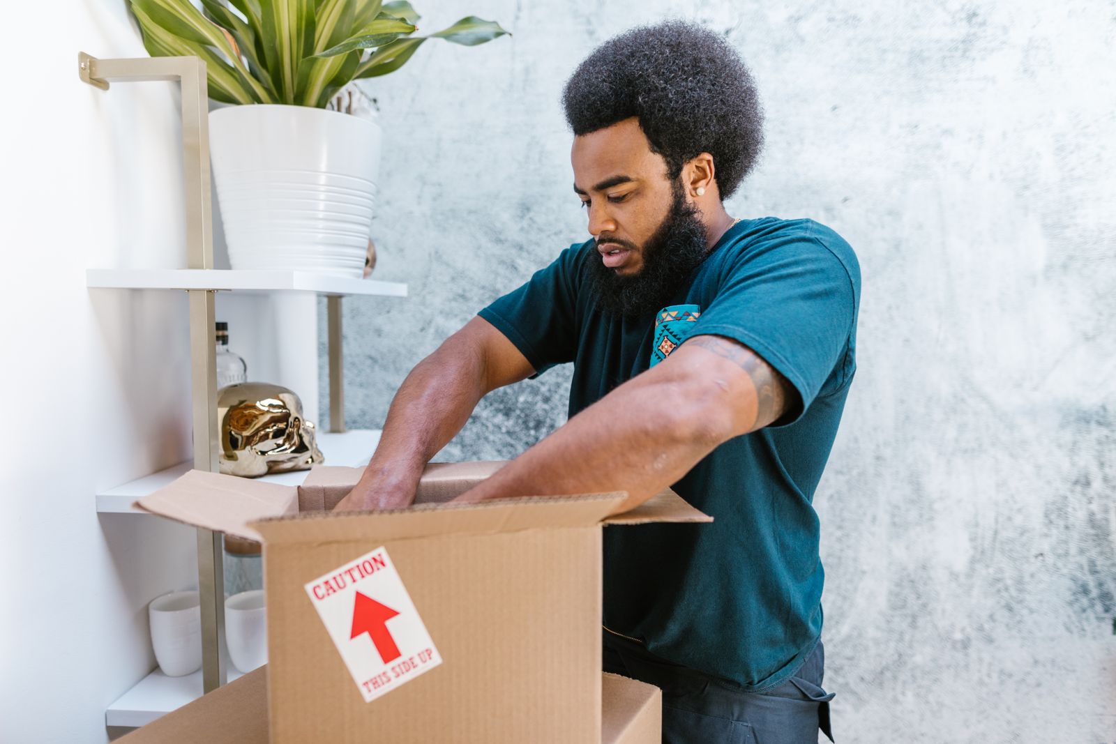 Mover carefully packing a box