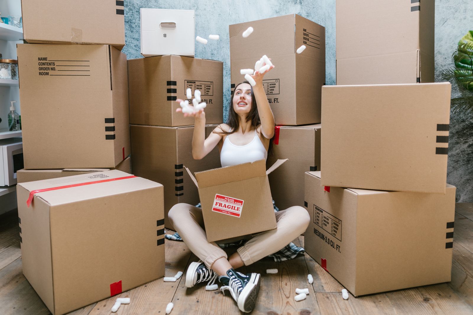 Woman surrounded by moving boxes
